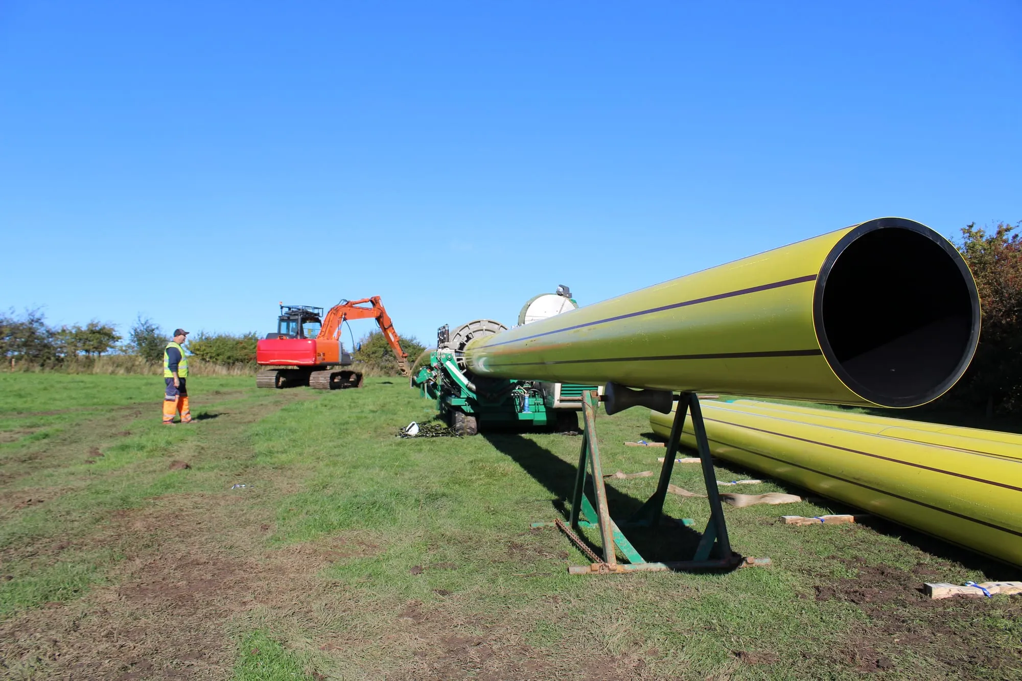 Large-diameter pipe being welded on site before a trenchless installation