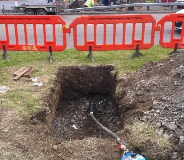 Impact moling used to install a service duct beneath a carriageway