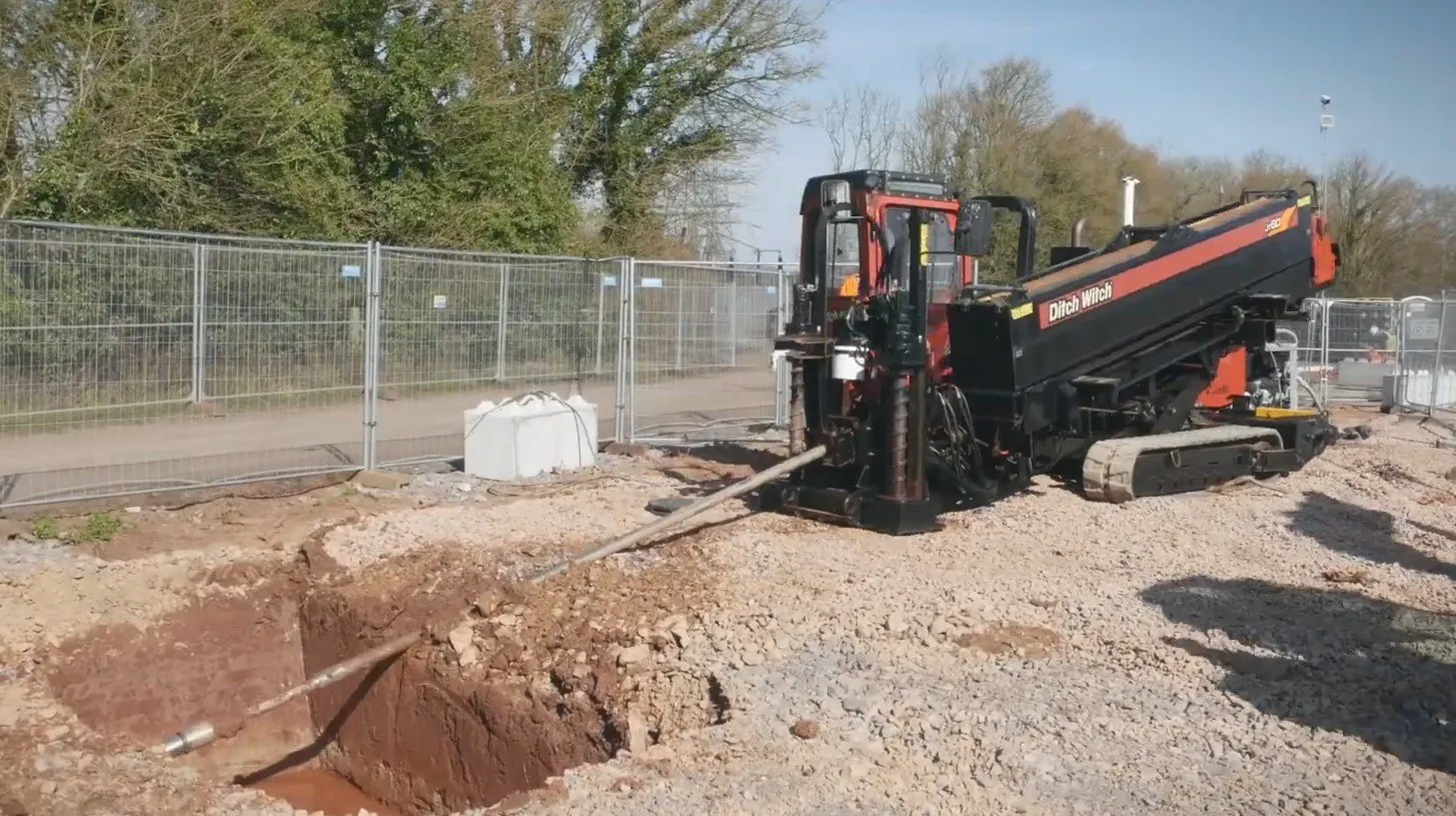 S.W.Directional Drilling crew and rig installing electric cable ducts at Iron Acton